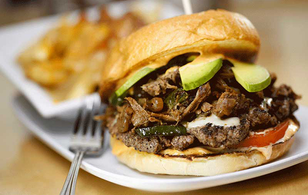 Crave Real Burgers' Colorado burger comes with  shredded lamb, poblanos, onions, pepper jack, avocado, chipotle mayo and tomato. Photo courtesy of Crave.