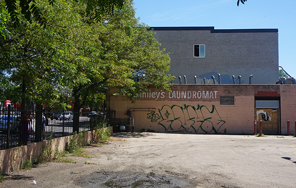 The site includes the former Smiley's Laundromat apartment project and an empty lot. Photos by Burl Rolett. 