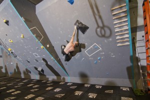A climber reaches for the next hand hold at Mountain Strong's grand opening. Photo courtesy of Mountain Strong.