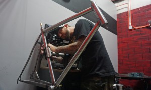 Jeff Wagner works on a road bike frame at the Alchemy shop.
