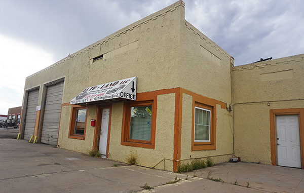 Two small buildings sit on a lot recently sold to a developer. Photos by Burl Rolett.