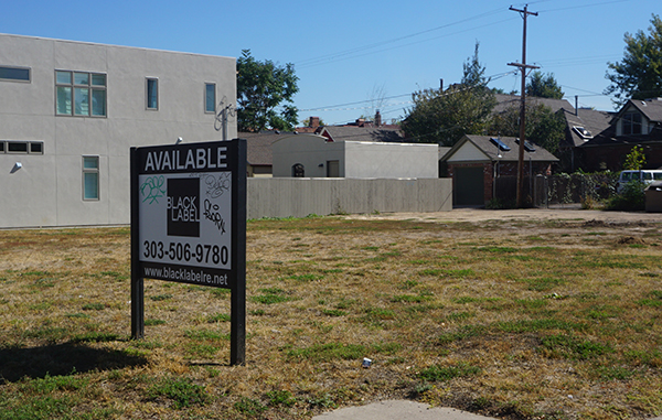 A lot at 25th and Stout streets has been sold to a developer. Photo by Burl Rolett.