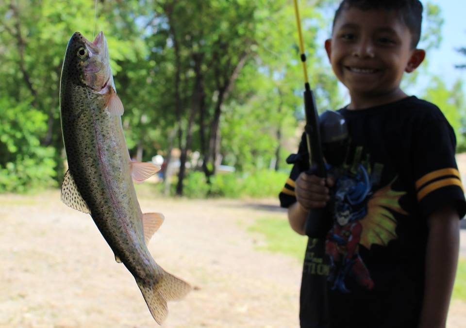 An ELK student shows off his catch at a fishing clinic. Photos courtesy of ELK.
