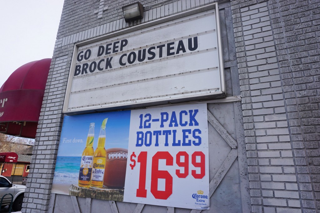 A liquor store is hoping to drum up some extra business with a cheeky marquee. Photos by George Demopoulos.