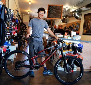  Adam Williams, owner of SloHi Bike Shop, with the new Spot bike. Photo by Stephanie Mason.