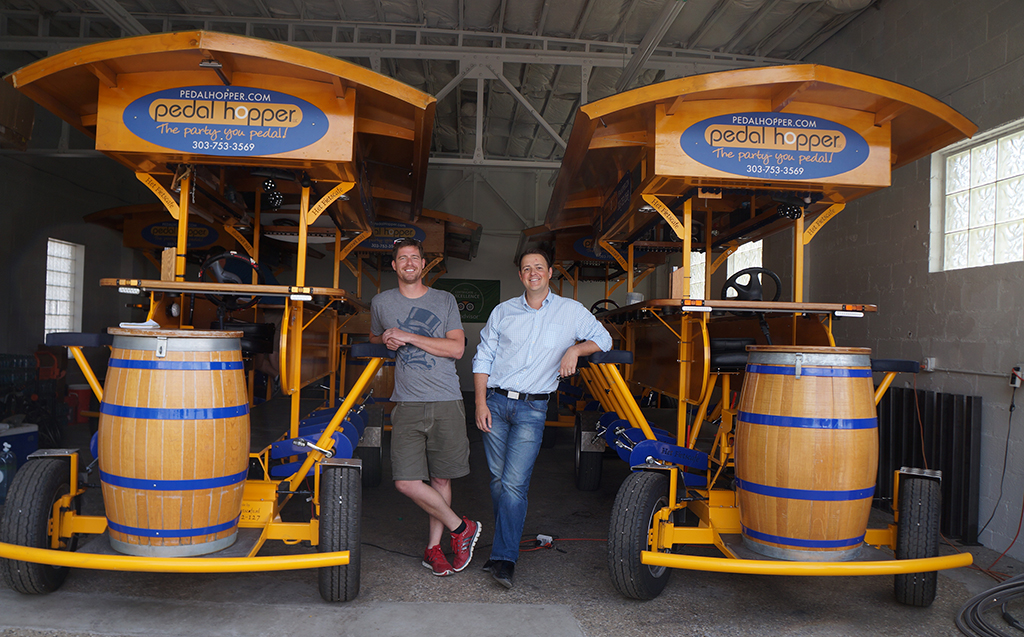 Founders Luke Stone, left, and Grant Barnes with the 16-person bar on wheels.