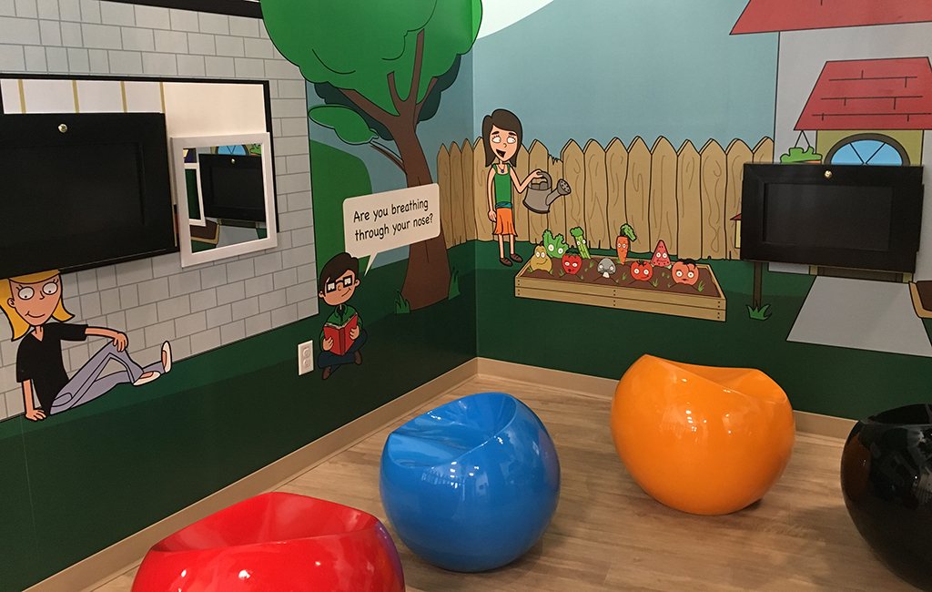 The lobby is set up like a play area, with computers and other games teaching children healthy dental habits. (Courtesy Neo Dental)