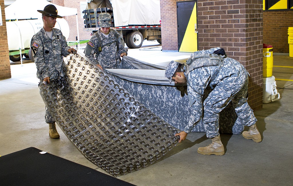 Military members reassemble a Skydex mattress. (Courtesy Skydex)