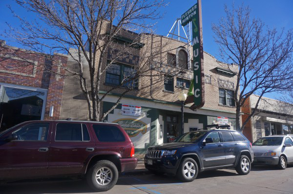 The former Flesher-Hinton Music Co. building at 3936 Tennyson St. was sold for $1.15 million.